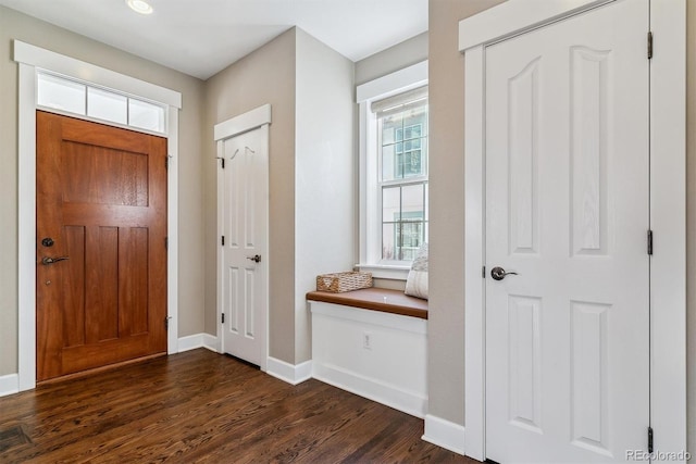 entrance foyer featuring dark wood-style floors and baseboards