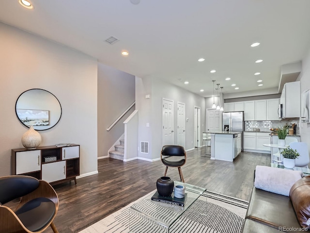 living room with dark wood-type flooring