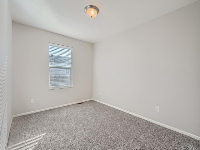 empty room featuring carpet floors