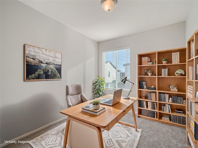 office area featuring light colored carpet