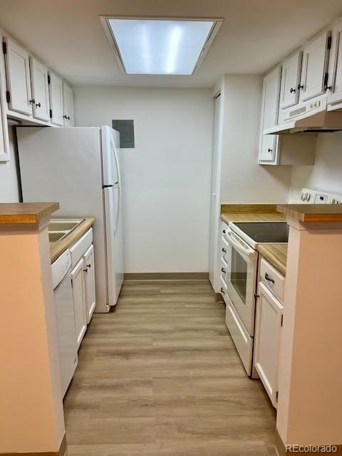 4400 S Quebec St Unit 102R, Denver, CO 80237 - kitchen with under cabinet range hood, white appliances, light wood-type flooring, and white cabinetry