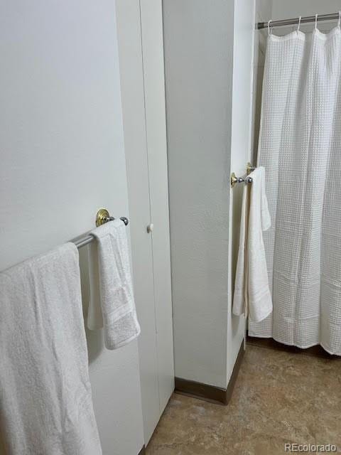 4400 S Quebec St Unit 102R, Denver, CO 80237 - full bath featuring curtained shower