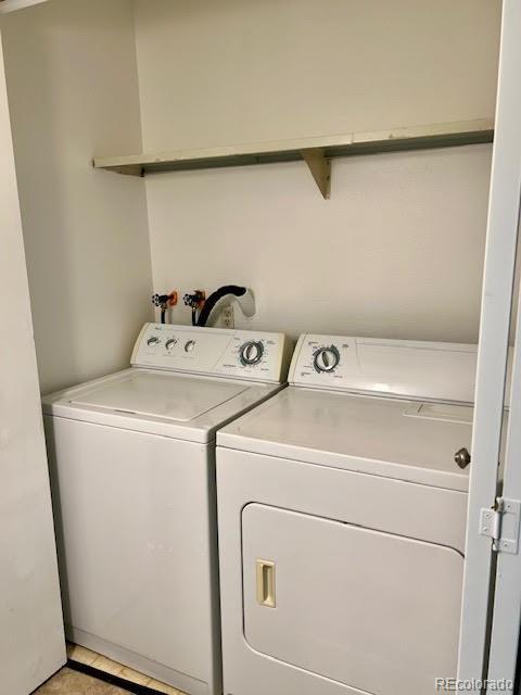 4400 S Quebec St Unit 102R, Denver, CO 80237 - washroom with washer and clothes dryer