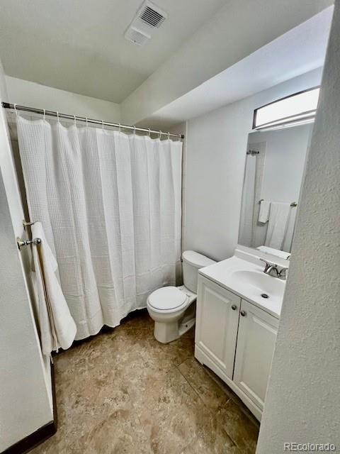 4400 S Quebec St Unit 102R, Denver, CO 80237 - full bath with vanity and a shower with curtain