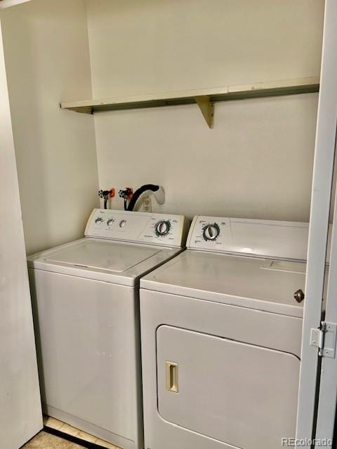 4400 S Quebec St Unit 102R, Denver, CO 80237 - washroom featuring independent washer and dryer