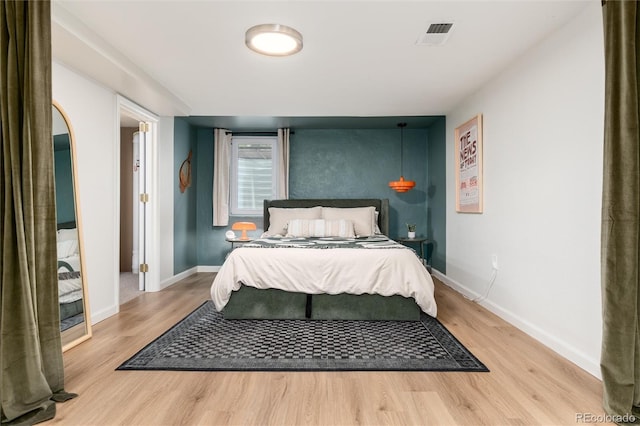 4520 S Delaware St, Englewood, CO 80110 - bedroom featuring light wood-type flooring and baseboards