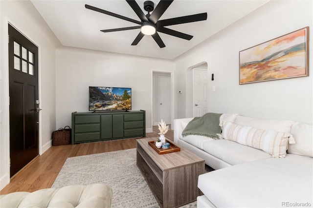 4520 S Delaware St, Englewood, CO 80110 - living area featuring a ceiling fan, wood finished floors, baseboards, and arched walkways
