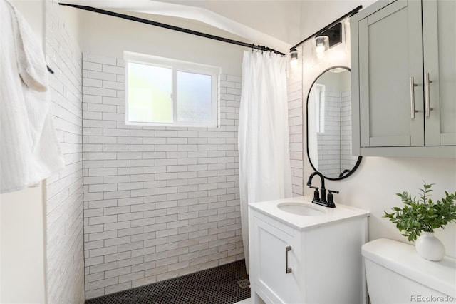 4520 S Delaware St, Englewood, CO 80110 - full bathroom with vanity, tiled shower, and toilet