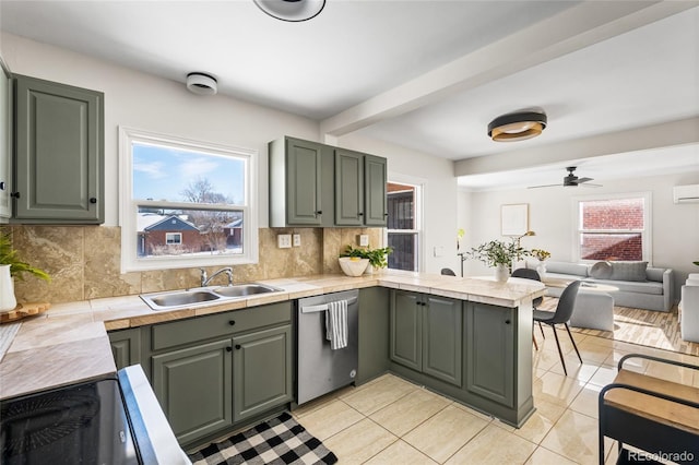 kitchen featuring sink, dishwasher, tasteful backsplash, light tile patterned flooring, and kitchen peninsula