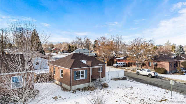 view of snow covered property