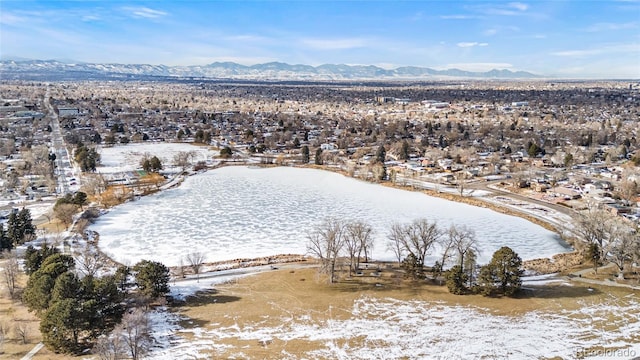 snowy aerial view with a mountain view