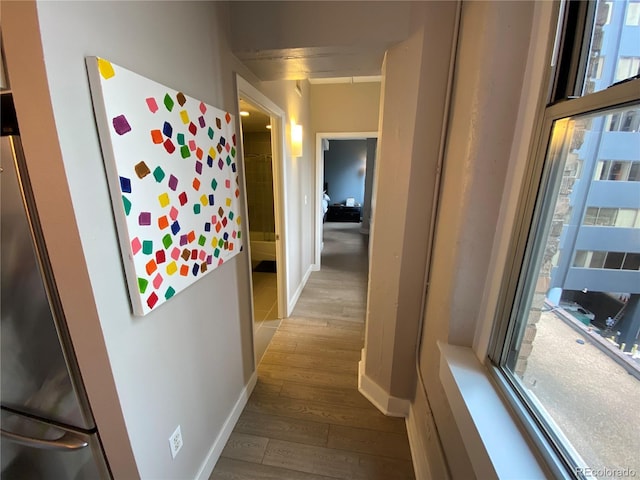 444 17th St Unit 508, Denver, CO 80202 - hallway featuring wood finished floors and baseboards