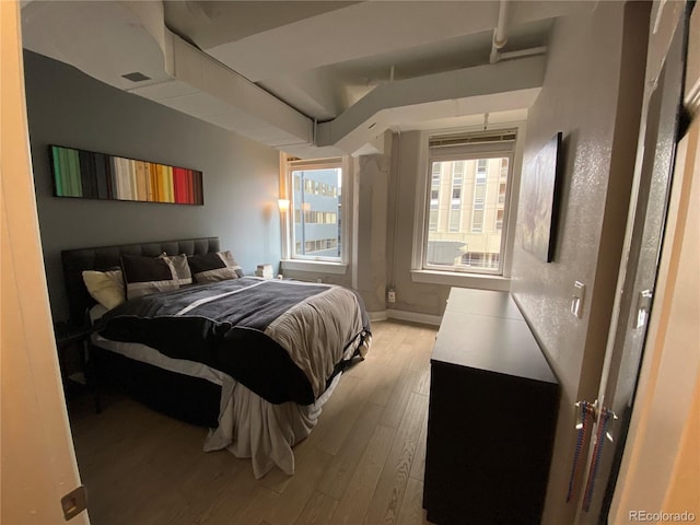 444 17th St Unit 508, Denver, CO 80202 - bedroom featuring wood finished floors and baseboards