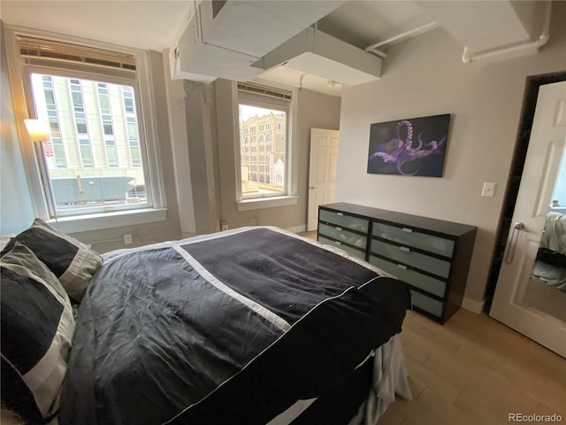 444 17th St Unit 508, Denver, CO 80202 - bedroom featuring light wood-style flooring and baseboards