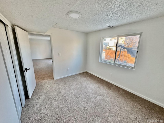 4036 S Himalaya Cir, Aurora, CO 80013 - carpeted spare room featuring a textured ceiling and baseboards