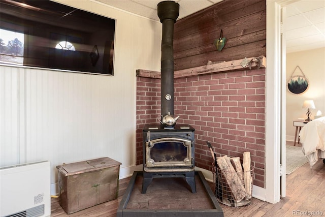 140 Eighth St, Fairplay, CO 80440 - detailed view of a wood stove, wood finished floors, and baseboards