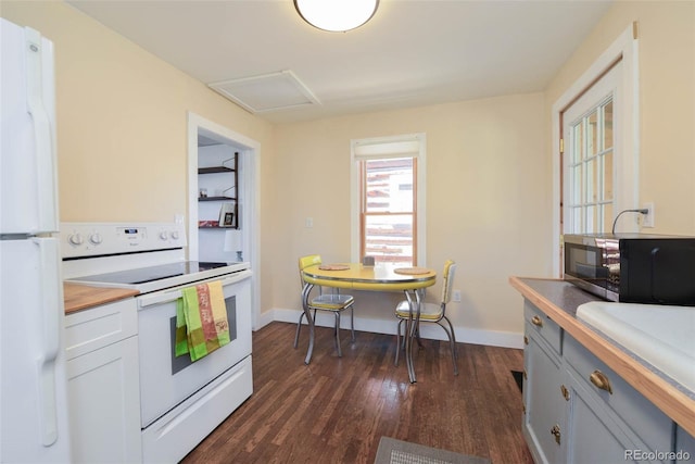 140 Eighth St, Fairplay, CO 80440 - kitchen with white appliances, butcher block countertops, dark wood-style floors, and baseboards