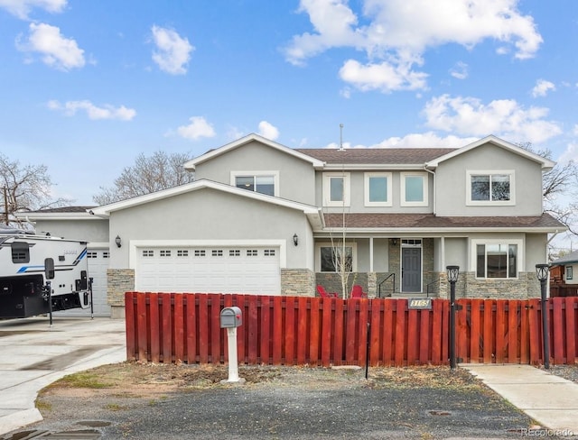 3165 W 63rd Ave, Denver, CO 80221 - traditional home with a fenced front yard, stucco siding, and stone siding