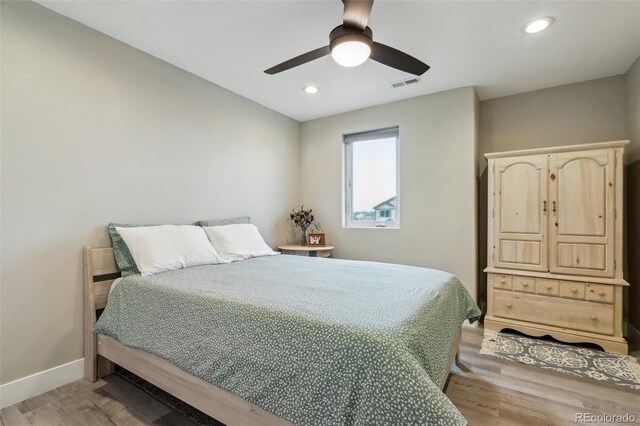 3165 W 63rd Ave, Denver, CO 80221 - bedroom with light wood-style floors, baseboards, a ceiling fan, and visible vents