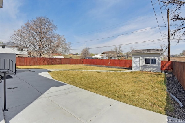 3165 W 63rd Ave, Denver, CO 80221 - view of yard featuring an outbuilding, a fenced backyard, a shed, and a patio area