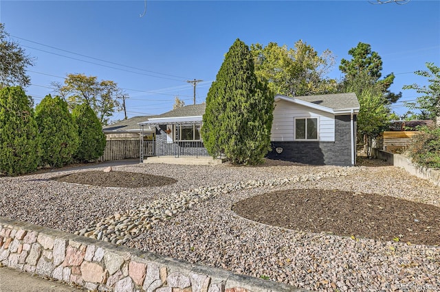 back of property with covered porch