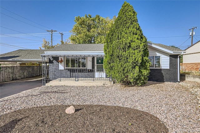 view of front of property featuring covered porch