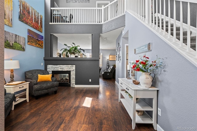 16086 E 97th Pl, Commerce City, CO 80022 - living room with wood finished floors, a towering ceiling, and a fireplace