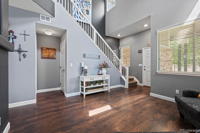 16086 E 97th Pl, Commerce City, CO 80022 - entryway with stairs, wood finished floors, a high ceiling, and recessed lighting