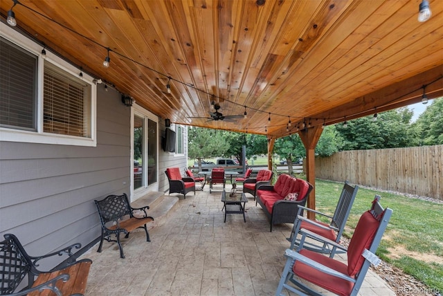 16086 E 97th Pl, Commerce City, CO 80022 - fenced backyard with an outdoor living space, a patio area, and ceiling fan