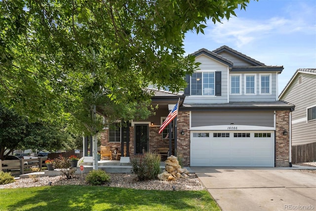 16086 E 97th Pl, Commerce City, CO 80022 - view of front of house featuring brick siding, concrete driveway, a porch, an attached garage, and a tiled roof