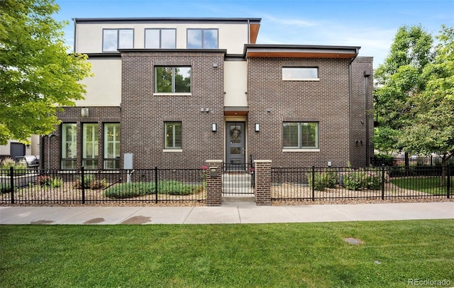 3690 W Byron Pl, Denver, CO 80211 - view of front facade featuring a fenced front yard, stucco siding, and brick siding