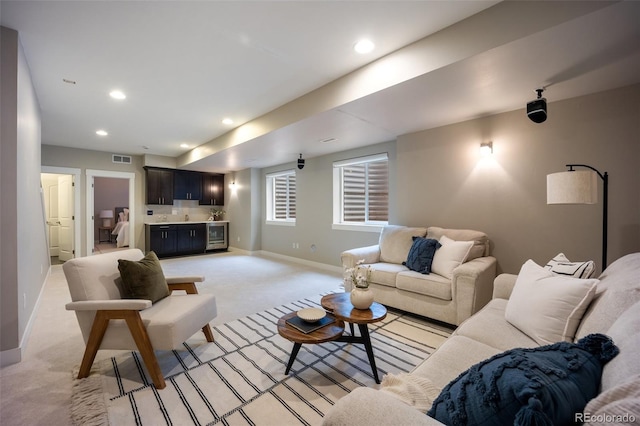 3690 W Byron Pl, Denver, CO 80211 - living area with light carpet, recessed lighting, and bar area