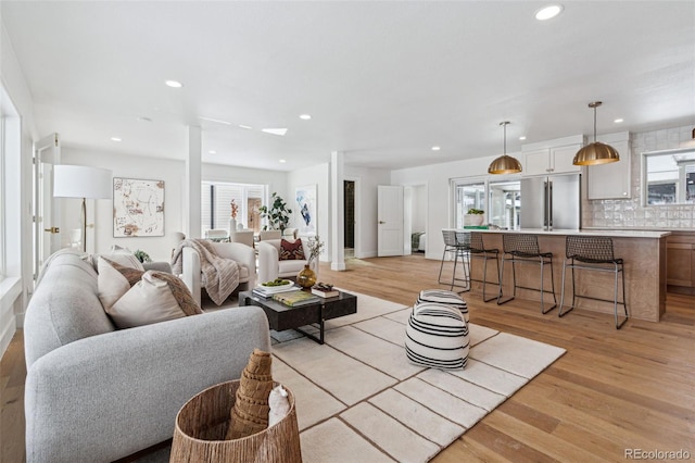 living room with light hardwood / wood-style flooring