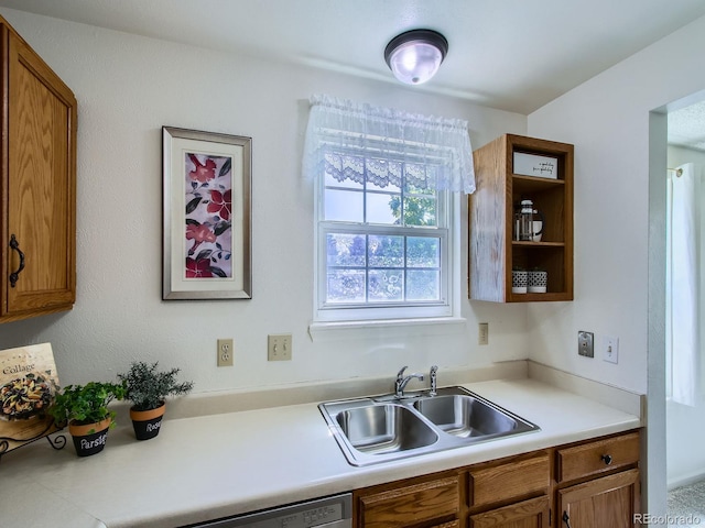 7700 N Depew St Unit 1518, Arvada, CO 80003 - kitchen with brown cabinets, light countertops, and dishwasher
