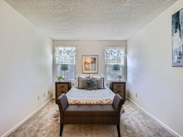 7700 N Depew St Unit 1518, Arvada, CO 80003 - carpeted bedroom featuring a textured ceiling and baseboards