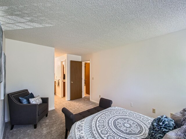 7700 N Depew St Unit 1518, Arvada, CO 80003 - bedroom with carpet flooring and a textured ceiling