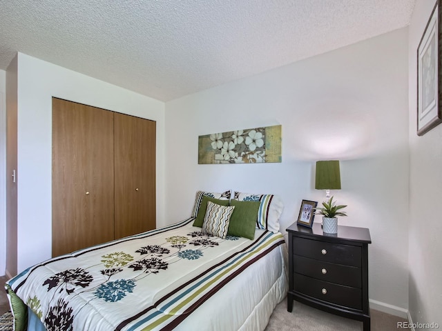 7700 N Depew St Unit 1518, Arvada, CO 80003 - bedroom featuring light colored carpet, a closet, and a textured ceiling