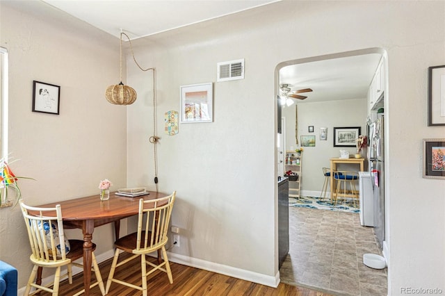 1856 S Garfield St, Denver, CO 80210 - dining room with a ceiling fan, baseboards, and wood finished floors