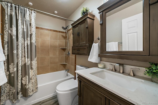 bathroom featuring vanity, toilet, and shower / bath combo with shower curtain