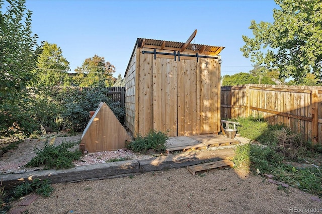 view of shed featuring a fenced backyard