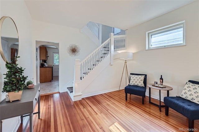 sitting room featuring plenty of natural light and wood-type flooring