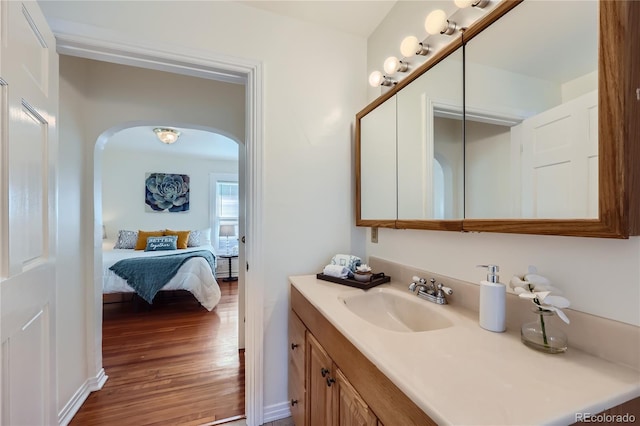 bathroom featuring vanity and hardwood / wood-style flooring