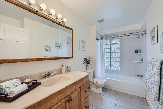 2854 Eliot St, Denver, CO 80211 - bathroom with shower / bath combo with shower curtain, toilet, visible vents, tile patterned floors, and vanity