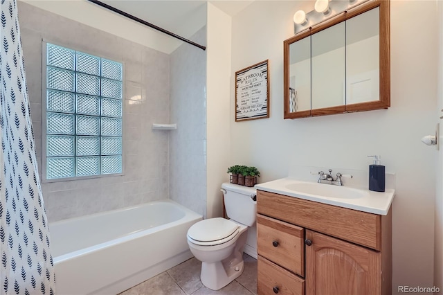 full bathroom featuring tile patterned floors, vanity, toilet, and shower / tub combo