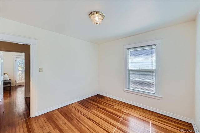 unfurnished room featuring wood-type flooring