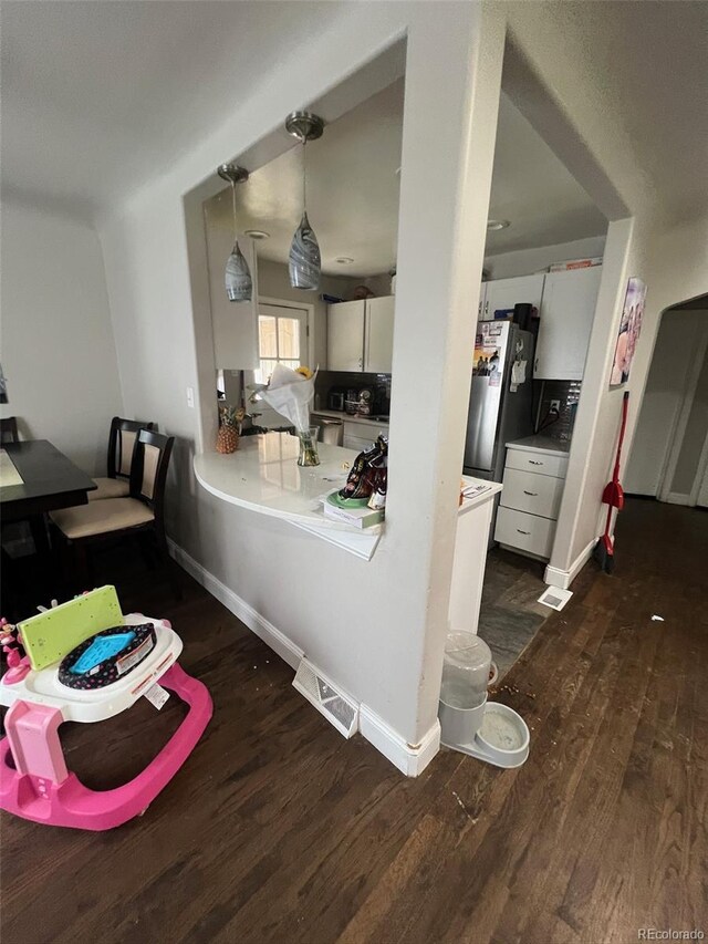 2655 Pontiac St, Denver, CO 80207 - dining area with wood finished floors and baseboards