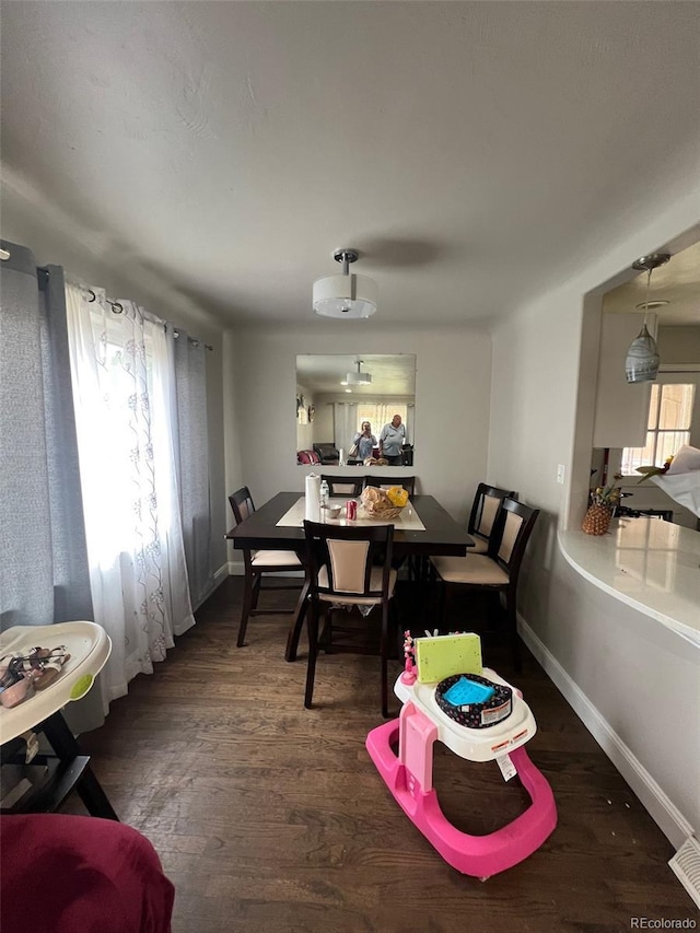 2655 Pontiac St, Denver, CO 80207 - dining space featuring wood finished floors and baseboards