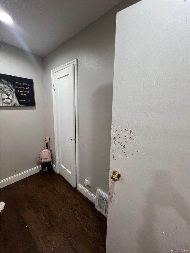2655 Pontiac St, Denver, CO 80207 - bathroom featuring wood finished floors and baseboards