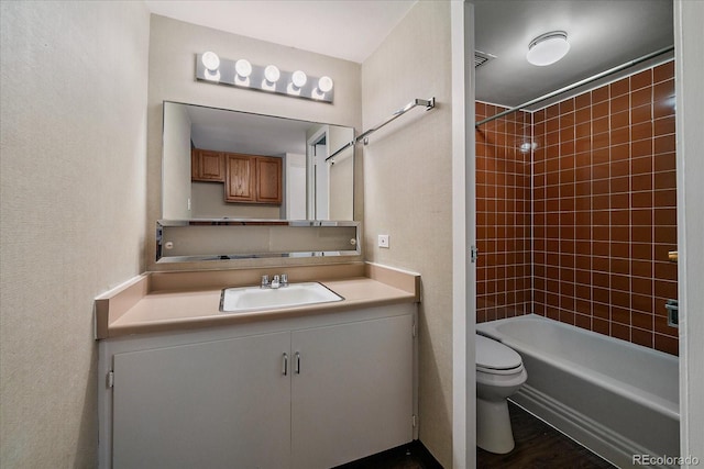 full bathroom with toilet, shower / bathtub combination, and vanity