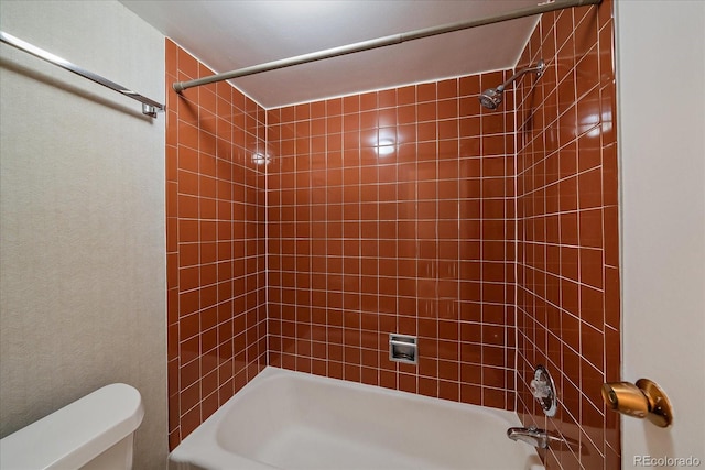 full bathroom with toilet and  shower combination